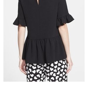 Kate Spade black ruffled sleeved and bottom shirt.
